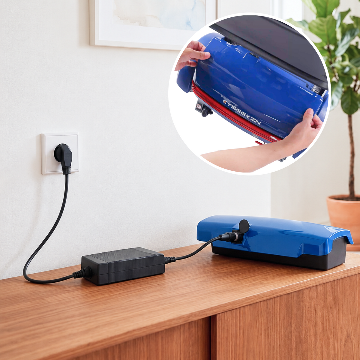 Blue air compressor on a wooden surface with a wall outlet in the background