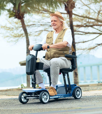 Senior using mobility scooter outdoors in a park environment
