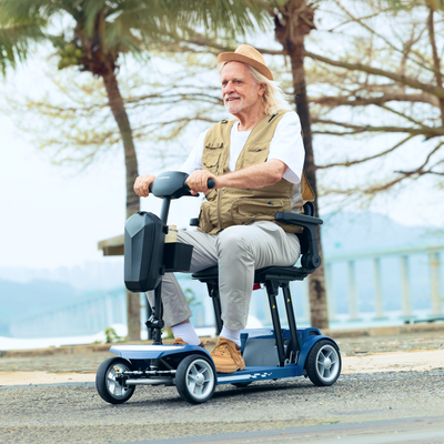 Senior using mobility scooter outdoors in a park environment